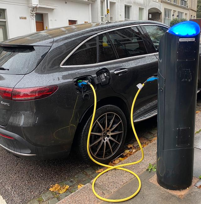An electric vehicle charges at a public fast-charging station in London on Oct. 20, 2022.  Courtney Bonnell / AP