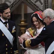 Prins Carl Philip, prinsessan Sofia med Gabriel och kung Carl Gustaf vid prins Gabriels dop i Drottningholms slottskyrka.
