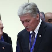 Rysslands president Putin och Dimitrij Peskov.