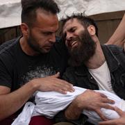 Palestinians mourn their relatives killed in the Israeli bombardment of the Gaza Strip, in a morgue in Khan Younis, Sunday, Oct. 29, 2023. ( AP Photo/Fatima Shbair)  XOB111