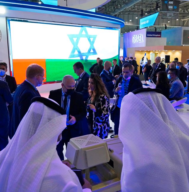 An Emirati and Israeli flag flash across a screen in the Israel Aerospace Industries stand at the Dubai Air Show in Dubai, United Arab Emirates, Monday, Nov. 15, 2021.  Jon Gambrell / AP