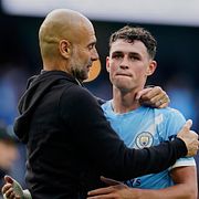 Tränare Pep Guardiola och Phil Foden.