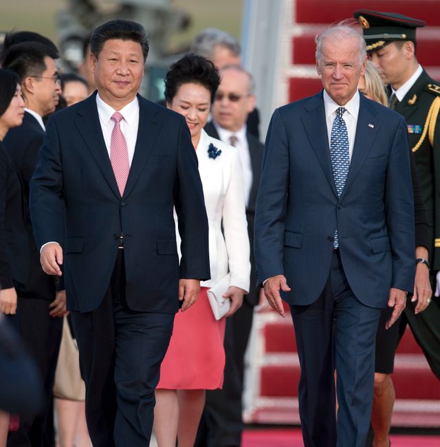 Chinese President Xi Jinping and Vice President Joe Biden walk down the red carpet on the tarmac during an arrival ceremony in Andrews Air Force Base, Md., Thursday, Sept. 24, 2015, as Chinese President Xi Jinping and his wife Peng Liyuan travel to Washington for a State Visit.  Carolyn Kaster / Ap
