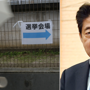 Kvinna utanför vallokal i Osaka och premiärminister Shinzo Abe.