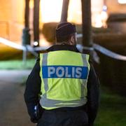 Polis på den misstänkta brottsplatsen