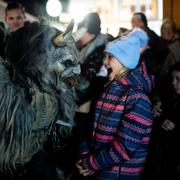 A participant wearing a traditional Krampus costume and a mask performs during a Krampus run in Hollabrunn, Austria, Sunday, Nov. 26, 2022. (AP Photo/Michael Gruber)  XMG10