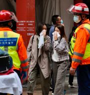 Räddningsinsats utanför World Trade Centre i Honkong.  Kin Cheung / AP