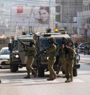 Israeliska soldater i Nablus på söndagen. Majdi Mohammed / AP