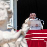 Pope Francis delivers his blessing from the window of his studio overlooking St.Peter's Square, at the Vatican, 2022.
