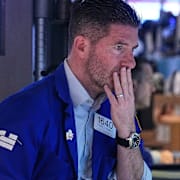 Specialist Thomas McArdle works on the floor of the New York Stock Exchange, Feb. 3.