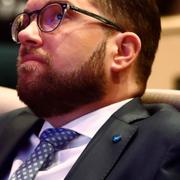 Åkesson i mitten, med medarbetare. Arkiv. 