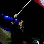 Pro-government Iranian demonstrators wave their country's flags in a gathering in Tehran, Iran, Sunday, June 7, 2026. (AP Photo/Vahid Salemi)  VAH120