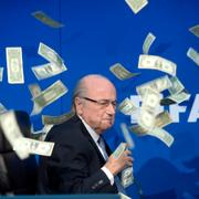 Under en presskonferens den 20 juli 2015 kastade en brittisk komiker dollarsedlar på Sepp Blatter, som fick sparken från FIFA efter korruptionsanklagelser.