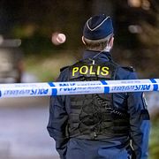 Polis på en brottsplats. Genrebild.