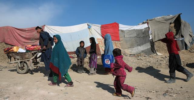 Afghansk familj på flykt.  Massoud Hossaini / TT NYHETSBYRÅN