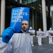 Activist holds a poster with the portrait of Meta`s CEO Mark Zuckerberg. Wednesday, April 17, 2024. They protested against disinformation they allege is on Meta's social network platforms.