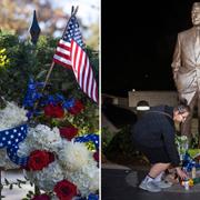 Blommor läggs vid en staty av George H W Bush i Washington DC. 