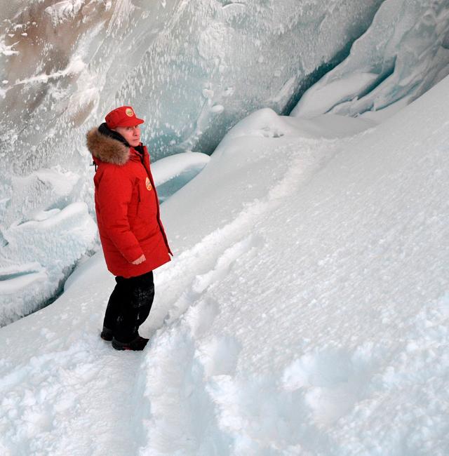 Russian President Vladimir Putin inspects a cavity in a glacier on the Arctic Franz Josef Land archipelago in Arctic Russia, Wednesday, March 29, 2017. Alexei Druzhinin / AP