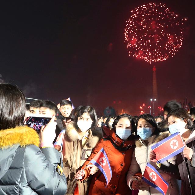 Citizens in Pyongyang. Fireworks explode to celebrate the New Year at Kim Il Sung Square. Cha Song Ho / AP