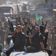 Beväpnade Hamasmedlemmar i samband med frigivningen av palestinska fångar. 