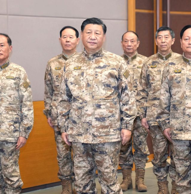 In this photo released by Xinhua News Agency, Chinese President Xi Jinping, front center, also general secretary of the Communist Party of China (CPC) Central Committee, chairman of the Central Military Commission (CMC), and commander-in-chief of the CMC joint operations command center, inspects the CMC joint operations command center on Wednesday, Nov. 8, 2022.  Li Gang / AP