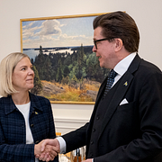 Andersson, Norlén och en bild på riksdagshuset.