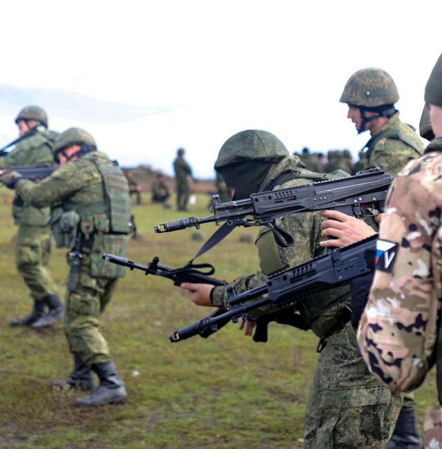 Recruits hold their weapons during a military training at a firing range in Donetsk People's Republic controlled by Russia-backed separatists, eastern Ukraine, Tuesday, Oct. 4, 2022. AP