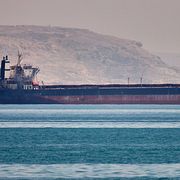 A bulk cargo ship sits at anchor in the Strait of Hormuz off Bandar Abbas, Iran, Saturday, May 2, 2026.(Amirhosein Khorgooi/ISNA via AP)  XEM108