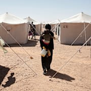 En kvinna som flytt från el-Fashir i ett flyktingläger, 16 november.