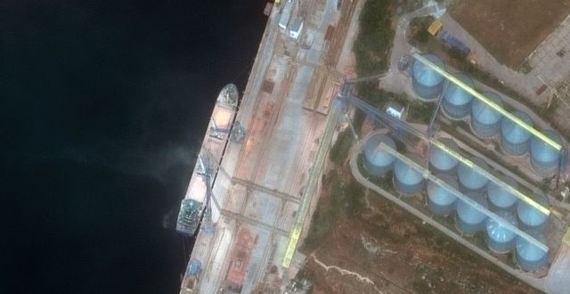 This satellite image from Maxar Technologies shows a close view of a ship loading grain in Sevastopol, Crimea, on June 12, 2022. AP