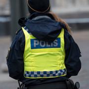 Ryggen på en polis. Arkivbild.