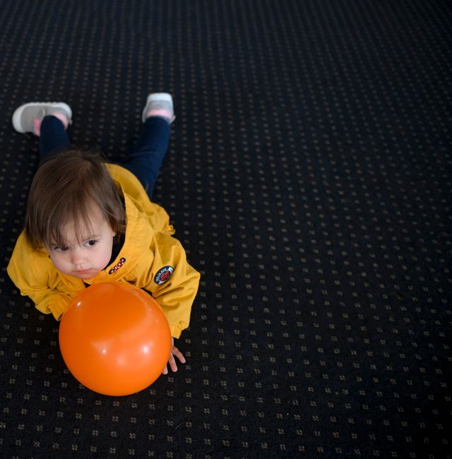  A child who fled the war from neighboring Ukraine plays with a ballon during an event for Ukrainian refugee children on Maundy Thursday in a center for refugees in Bucharest, Romania, Thursday, April 21, 2022 Andreea Alexandru / AP