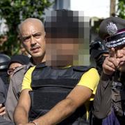 En av de gripna misstänkta för bombdådet i Bangkok.