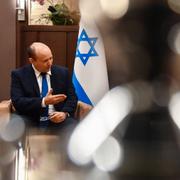 Rysslands president Vladimir Putin och Israels före detta premiärminister Naftali Bennett.