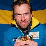 Johan Olsson med sina tre medaljer från skid-VM i Falun.