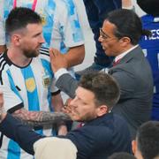 Nusret Gokce, right, is know as the chef or the Salt Bae puts his hand on the shoulder of Argentina's Lionel Messi end of the World Cup final soccer match between Argentina and France at the Lusail Stadium in Lusail, Qatar, Sunday, Dec. 18, 2022. FIFA is taking "appropriate internal action" to address breaches of World Cup protocol by a celebrity chef who held the gold trophy on the field, soccer's governing body said Thursday. (AP Photo/Hassan Ammar)  HAS112