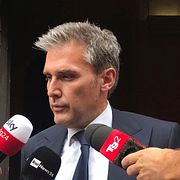 Advokaten till en av de åtalade männen. 