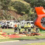 Räddningspersonal arbetar vid campingplatsen, som ligger vid Mount Maunganui på Nya Zeelands norra ö.