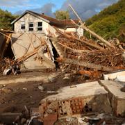 Homes sit destroyed by torrential rain and flooding in Buturovic Polje, Bosnia, Sunday, Oct. 6, 2024. (AP Photo/Armin Durgut)  XAD112