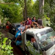 In this photo provided by Free Burma Rangers, villagers in the southern part of Myanmar's eastern state of Kayah flee attacks by the military government's forces on Friday, June 23, 2023. The military government uses air and ground attacks to try to crush the armed resistance that arose after the military seized power from the elected government of Aung San Suu Kyi in February 2021. Fighting has been fierce in southern Kayah, where members of an army-established ethnic Karenni militia recently defected en masse to the resistance side. (Free Burma Rangers via AP)  TOK804