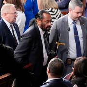 Rep. Al Green, D-Texas, center, is escorted out as President Donald Trump addresses a joint session of Congress at the Capitol in Washington, Tuesday, March 4, 2025. (AP Photo/Alex Brandon)  DCPU578