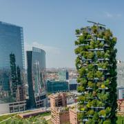 Aerial view of modern and ecologic skyscrapers in Italy, Milan. Vertical forest also called Bosco Verticale residential buildings with many trees and plants in balconies.