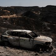 En utbränd bil i Bédar i södra Spanien den 11 juli.