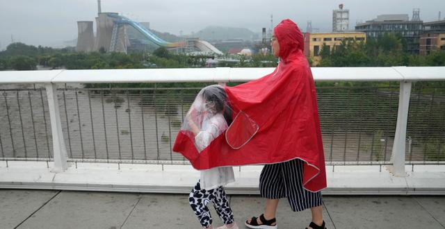 Regnväder i Peking. Andy Wong / AP