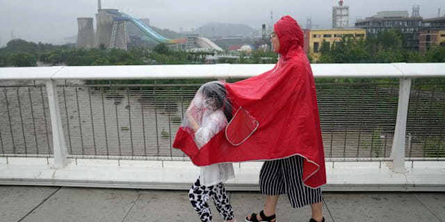 Regnväder i Peking. Andy Wong / AP