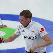 Brad Jacobs och Marc Kennedy i det kanadensiska laget. 
