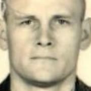 Ett passfoto av Dmitrij Utkin (född 1970) som tillgängliggjorts av Sankt Petersburgs-tidningen Fontanka.  Creative Commons