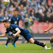 MFF:s Markus Rosenberg och IFK:s Thomas Rogne i kamp om bollen under lördagens premiär i allsvenskan mellan IFK Göteborgs och Malmö FF på Ullevi i Göteborg.