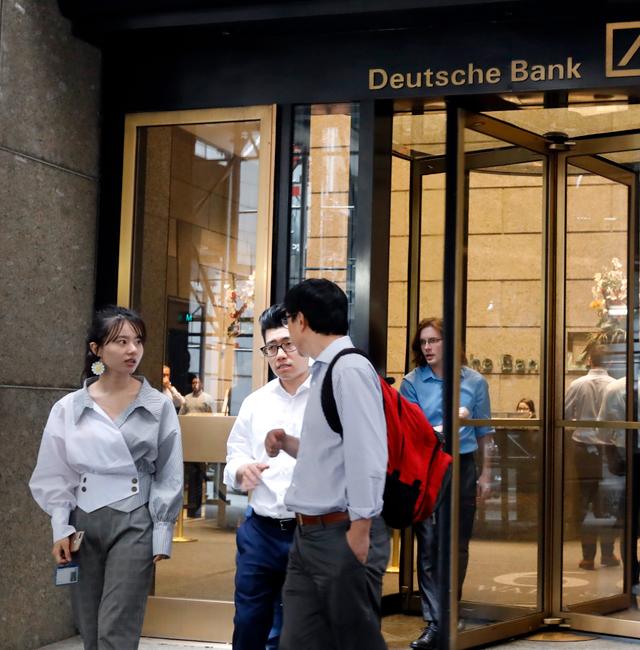  People leave Deutsche Bank in New York, Monday. Richard Drew / AP