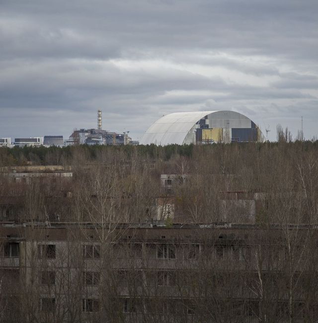 Chernobyl Reactor No. 4 rises over the mostly abandoned town of Pripyat in Ukraine John Wendle/The Wall Street Journal 